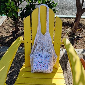Crocheted market bag with gifts inside