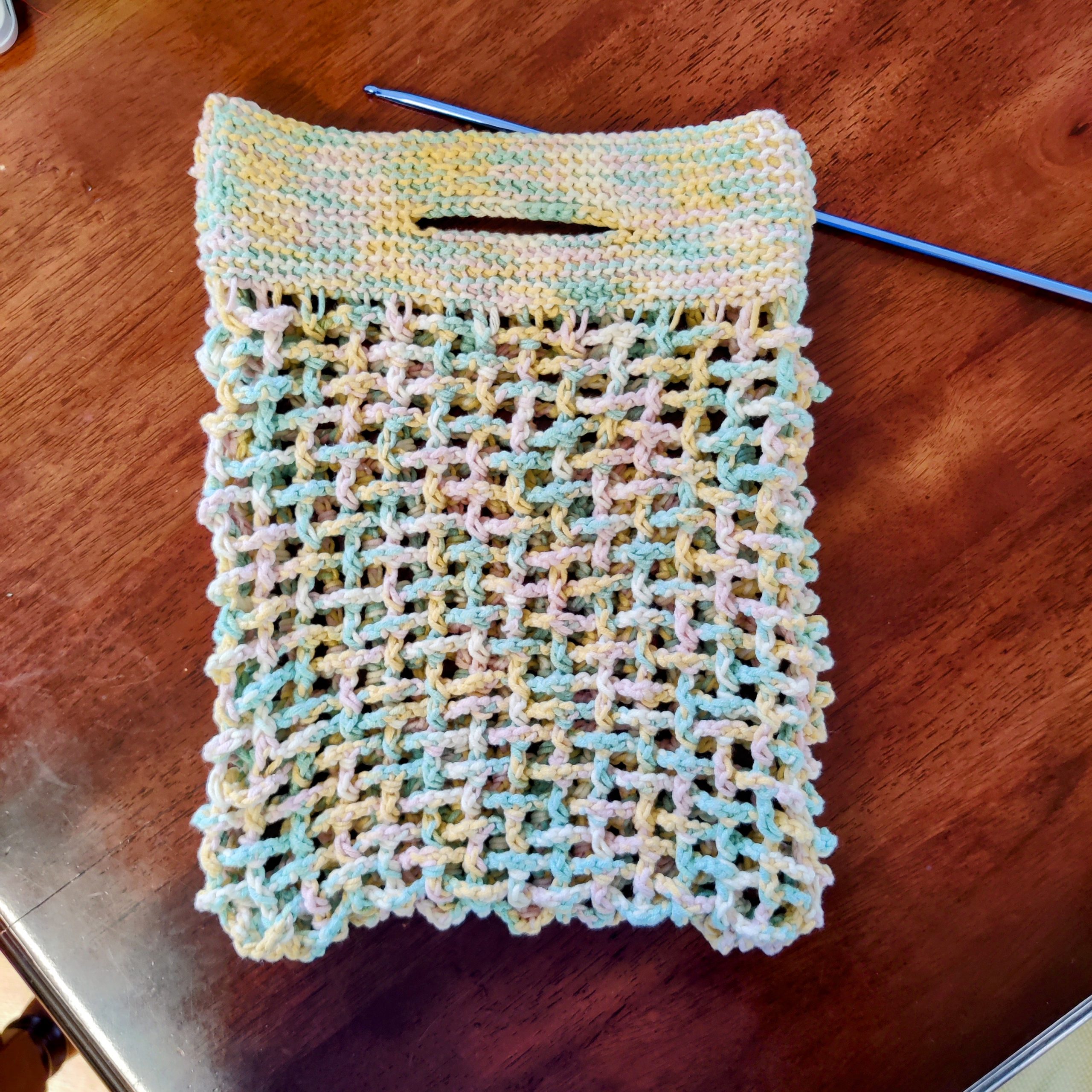 Tunisian crochet market bag with a Tunisian crochet hook